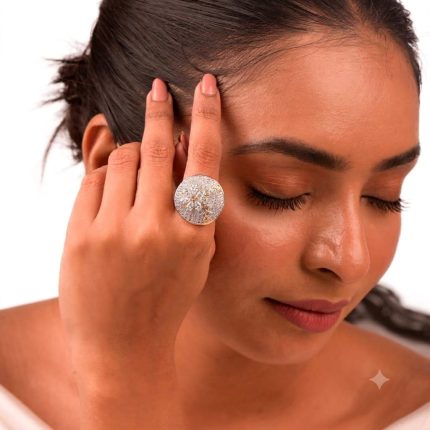 Large circular brass statement finger ring featuring gold and white dual-tone plating worn on a woman's & Girl's hand