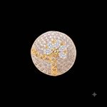 Large circular brass statement finger ring featuring gold and white dual-tone plating worn on a woman's & Girl's hand